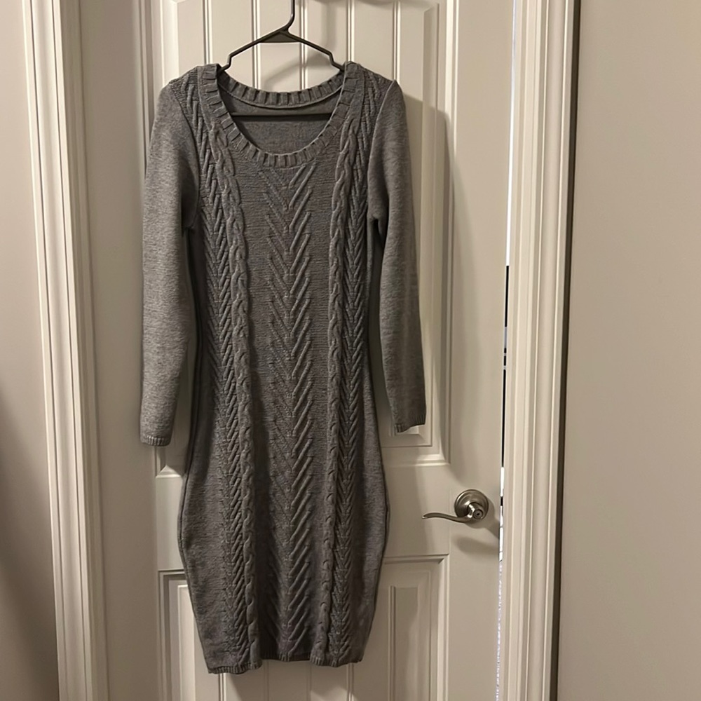 Sweater dress fits as medium true to size with some stretch